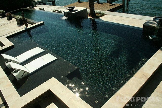 Pool with luxurious tanning ledge and lounge chairs